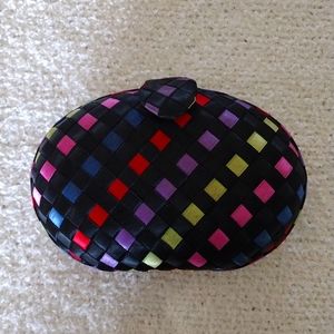 A Delill Creation weaved colorful clutch and crossbody bag